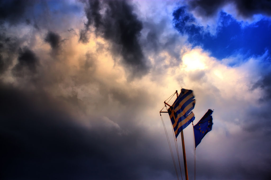 Greek flag in dark blue sky